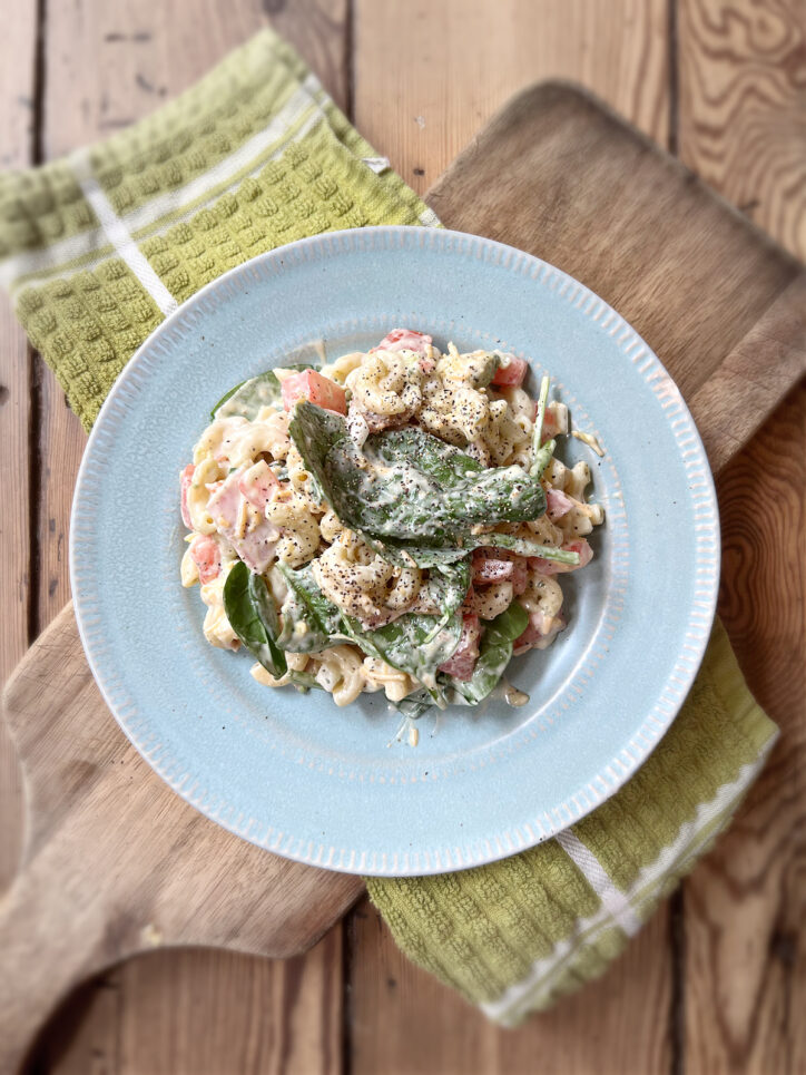 Best California Club Pasta Salad on blue plate.