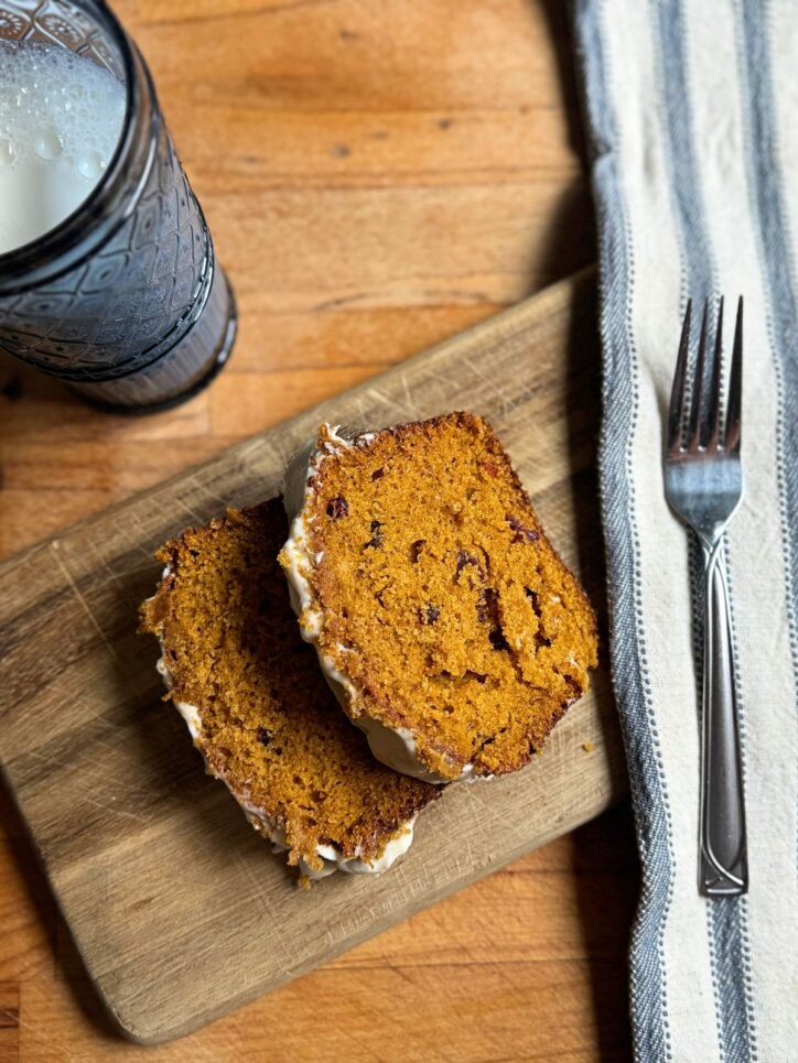 two slices of pumpkin cranberry bread
