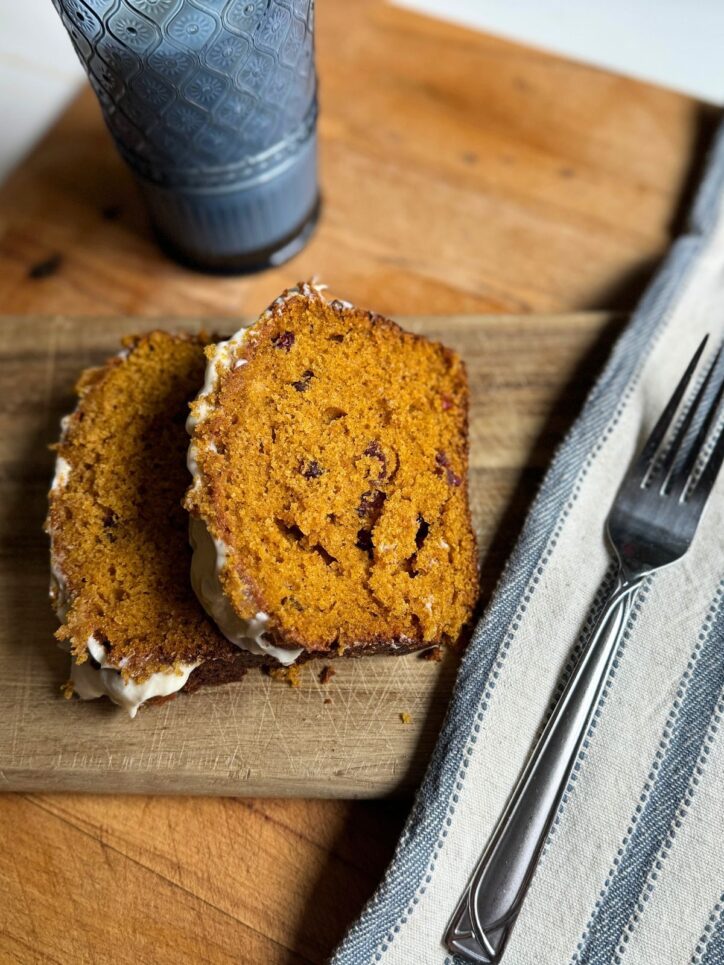 Pumpkin Cranberry Bread on a cutting board
