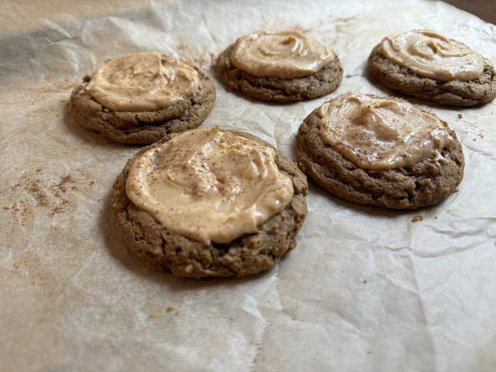 pumpkin cookies on parchment paper