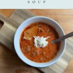 Bowl of lasagna soup on a cutting board with the text Easy Lasagna Soup