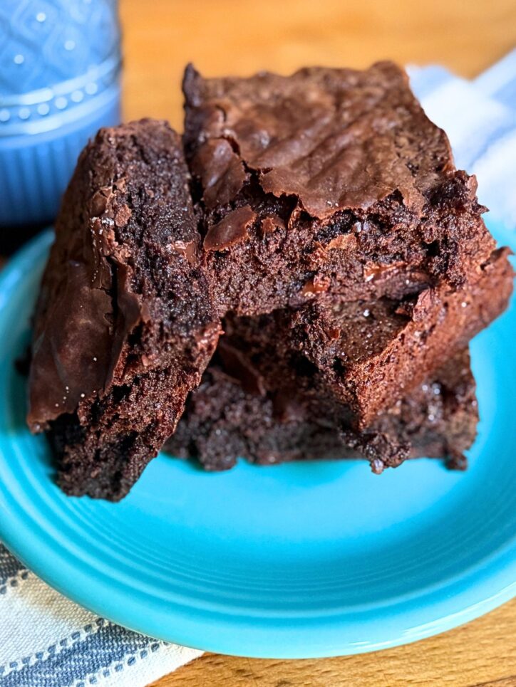 3 Ingredient Brownies piled on a blue plate