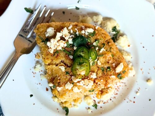 Mexican Street Corn Casserole on a plate with a fork