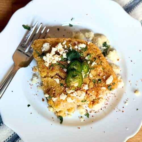 Mexican Street Corn Casserole on a plate with a fork