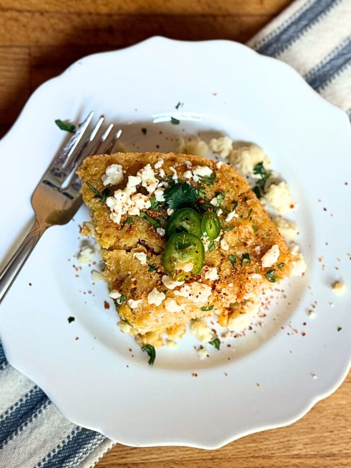 Mexican Street Corn Casserole on a plate with a fork