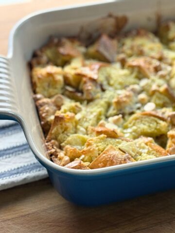 White Chocolate Almond Bread Pudding in a blue dish