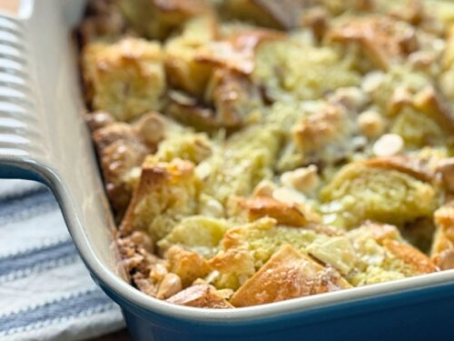 White Chocolate Almond Bread Pudding in a blue dish