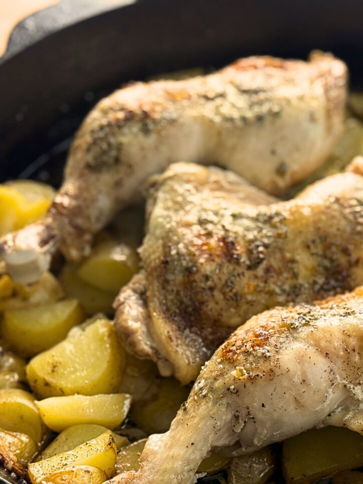 Chicken roasted over potatoes