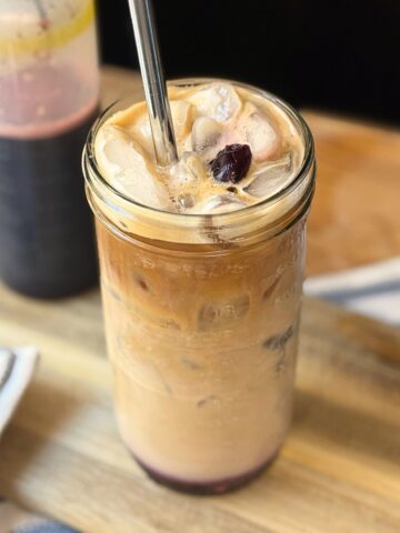 Iced coffee with Cherry Vanilla Syrup and a cherry on top