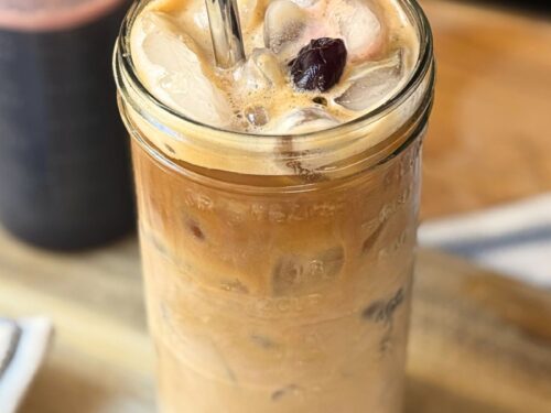 Iced coffee with Cherry Vanilla Syrup and a cherry on top