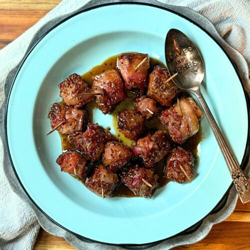 Bacon wrapped andouille sausage bites with a brown sugar sauce on top