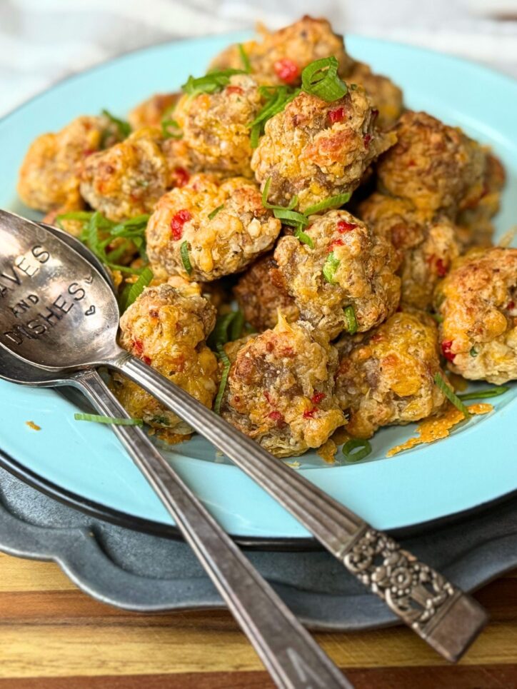 Sausage balls on a plate with a spoon