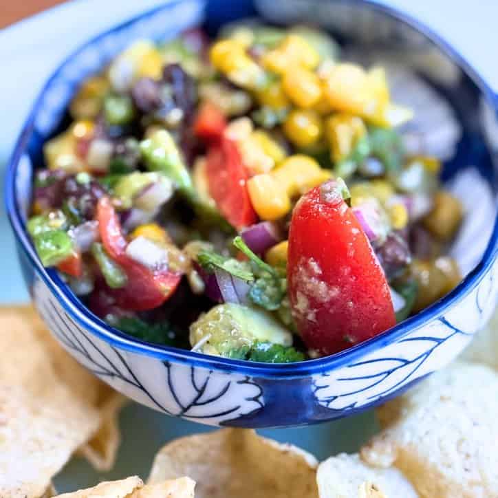 close up of vegetables in a blue and white bowl